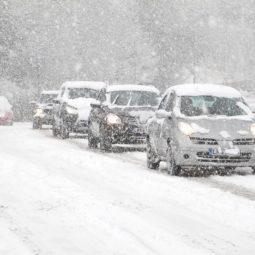 cars driving in heavy snow in england